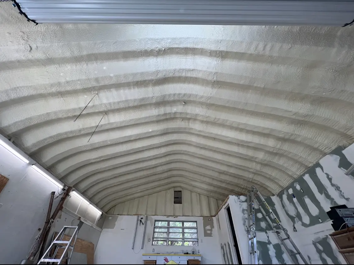 Spray polyurethane foam applied to the underside of a metal roof deck in Andover